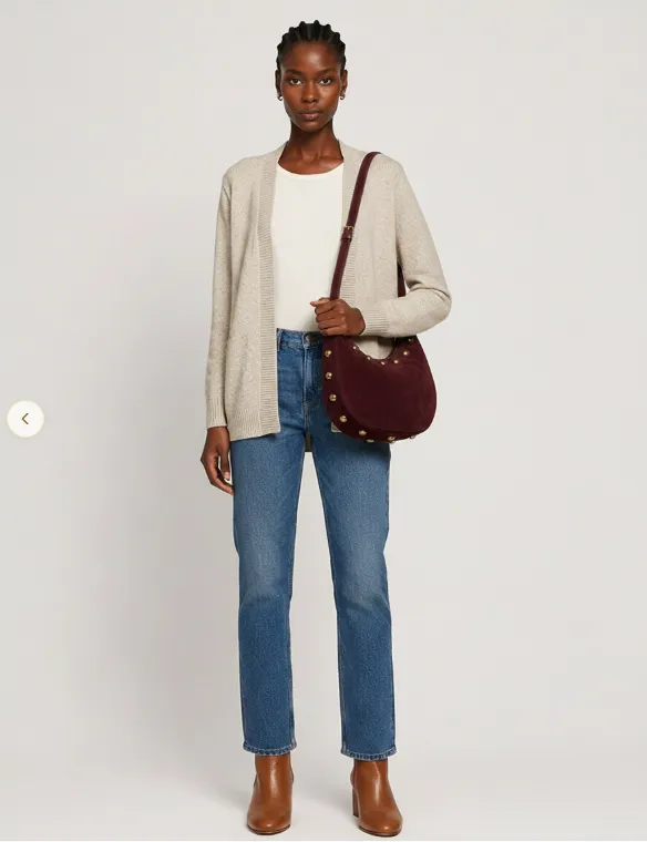 A try-on result: a cream cardigan over a white top with blue jeans, a burgundy shoulder bag and tan ankle boots.